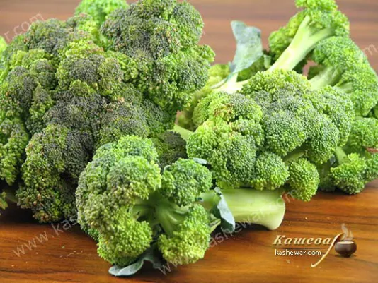 Fresh green broccoli floret on a kitchen table