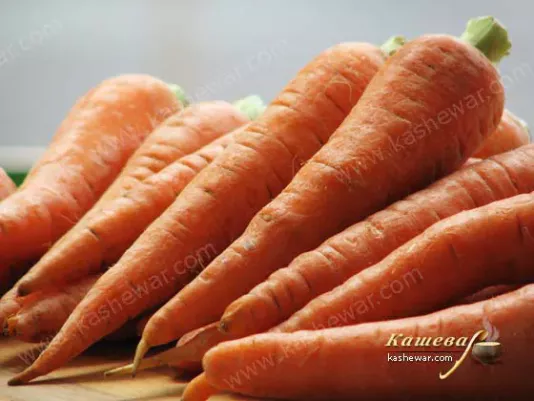 Fresh carrot on the kitchen table