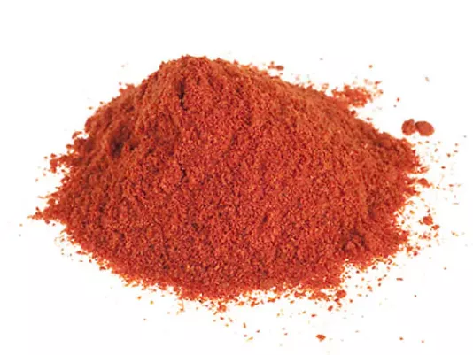 Ground red pepper scattered on the table