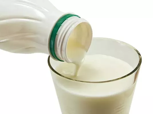 A glass of fresh kefir on the table