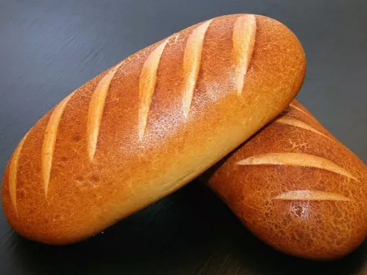 Freshly baked long loaf with a golden crust