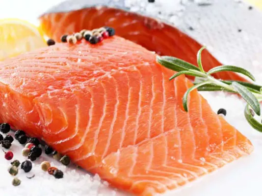 Appetizing slices of red fish with a glimmer of salt