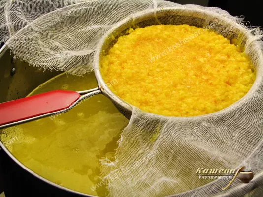 Straining orange oil cake