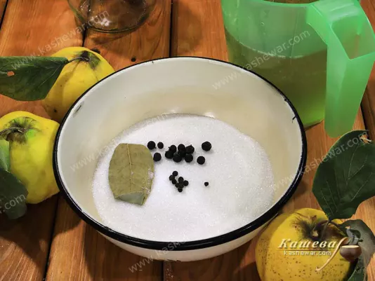 Sugar, juniper berries, black pepper and bay leaf for quince marinade