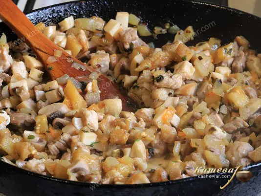 Pork, beef and vegetables in a pan