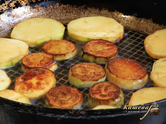 Peeled eggplant in a pan