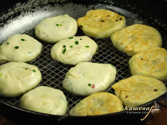 Frying pancakes in a pan in oil