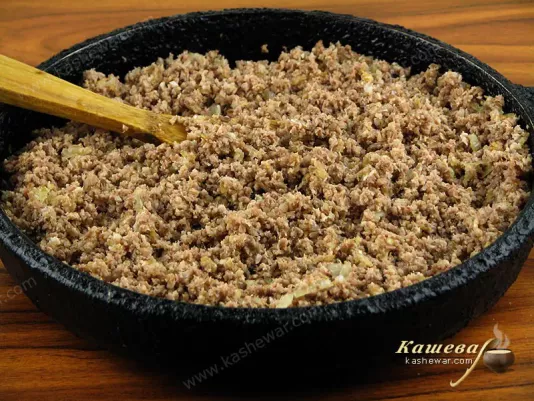 Fry chopped meat and onions in vegetable oil