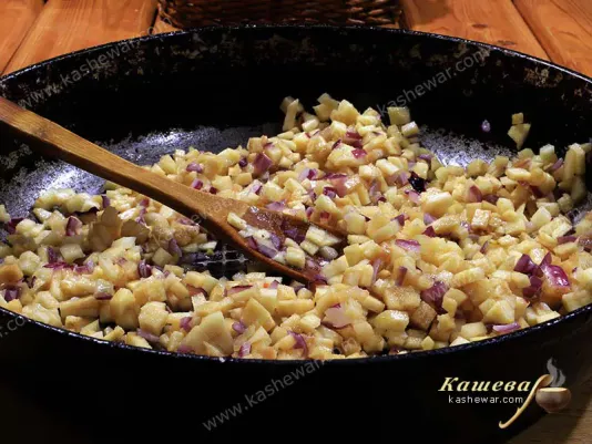 Quince and vegetables in a pan