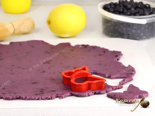 Cutting figures from bilberries dough