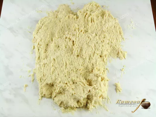 Spread the dough over the surface