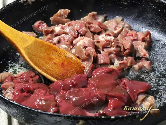 Chicken offal in a frying pan