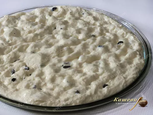 Focaccia dough on a baking sheet