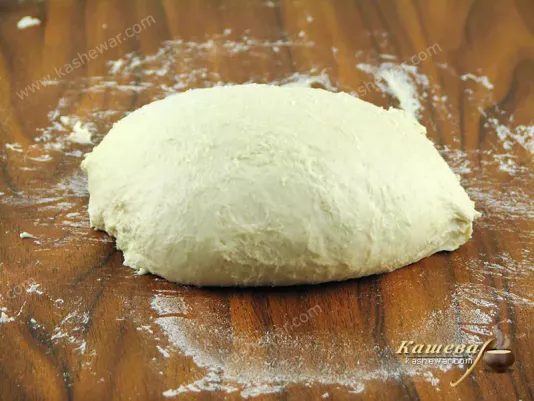 Kneading dough by stretching