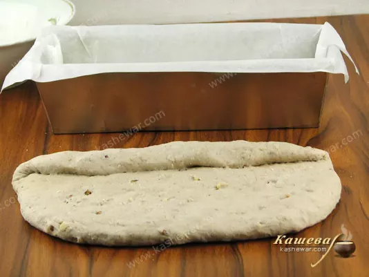 Putting the dough into a bread form