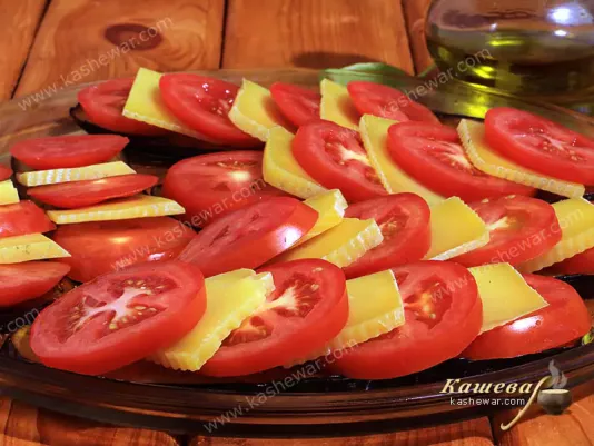 Tomatoes and cheese on eggplants