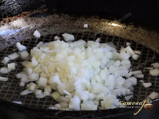 Finely chopped onion in a skillet