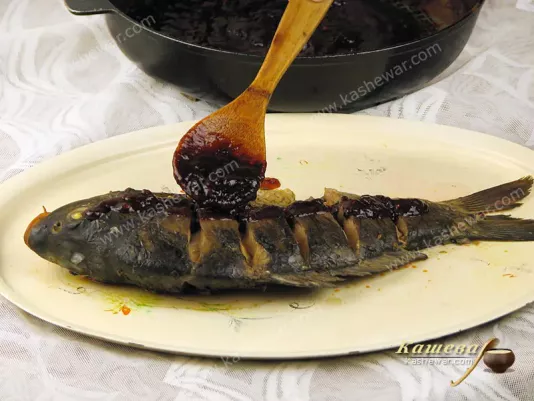 Pour sauce over carp