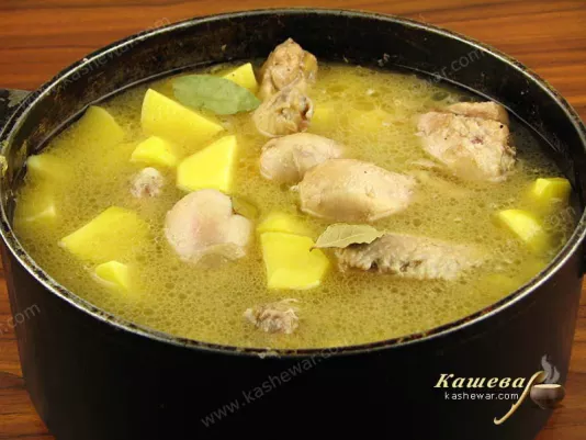 Pour broth over chicken and potatoes