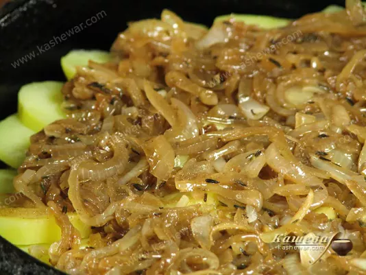 Putting onions in a baking dish