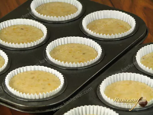 Pouring dough into cupcake molds