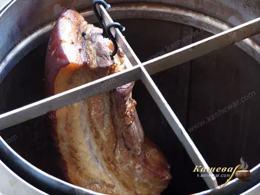 Smoked salo in a smokehouse