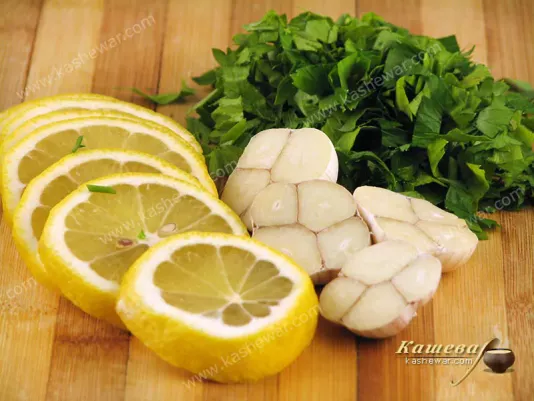 Preparing lemon, garlic and herbs for chicken