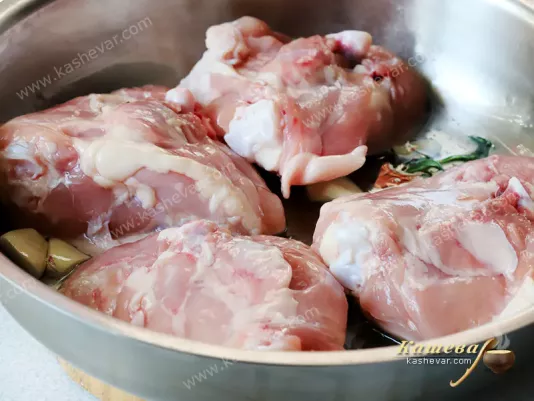 Chicken thighs in a frying pan