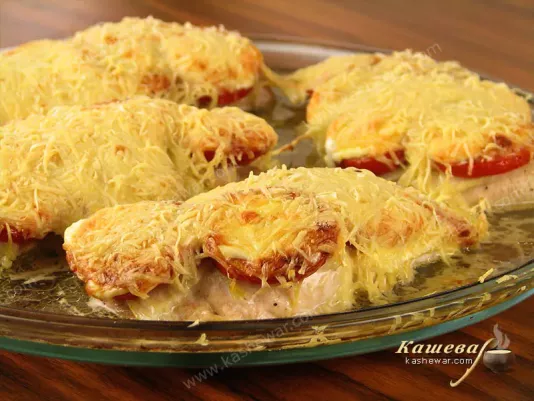 Baked chicken fillet with vegetables and cheese