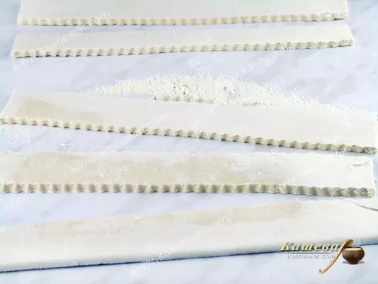 Roll out the dough and cut into strips