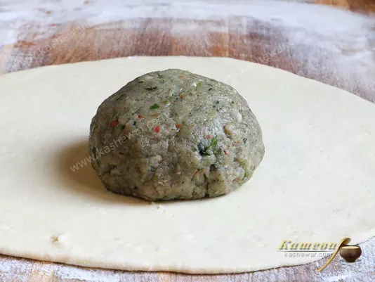 Ball of minced meat on the dough