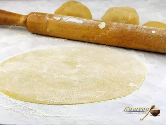 Divide the dough into pieces and roll out thinly
