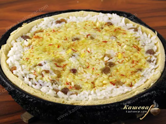 Pour pilaf with melted butter with saffron