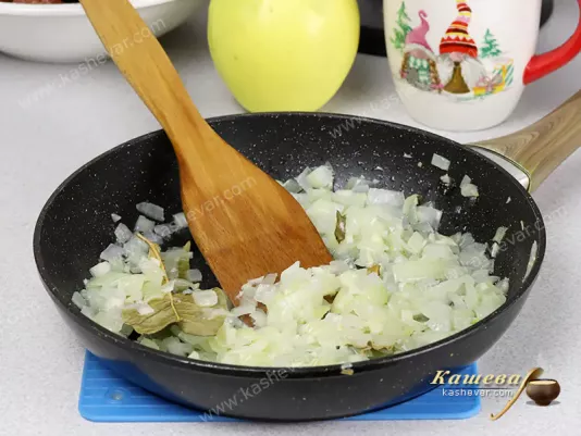 Onions and spices in a frying pan