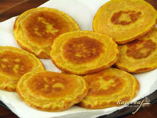Bake pumpkin pancakes on both sides in vegetable oil