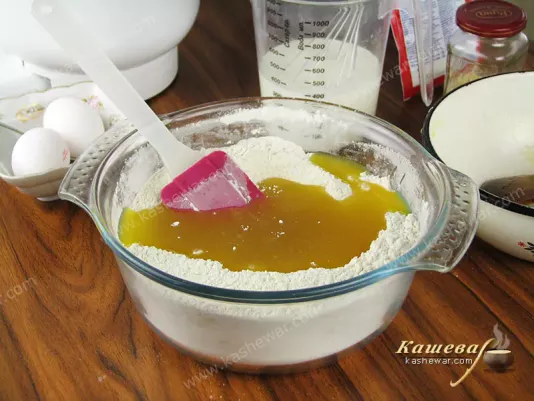 Pour the molasses into the flour mixture