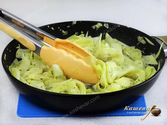 Ribbons of zucchini in a frying pan