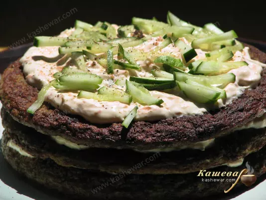 Spreading liver cake with cream