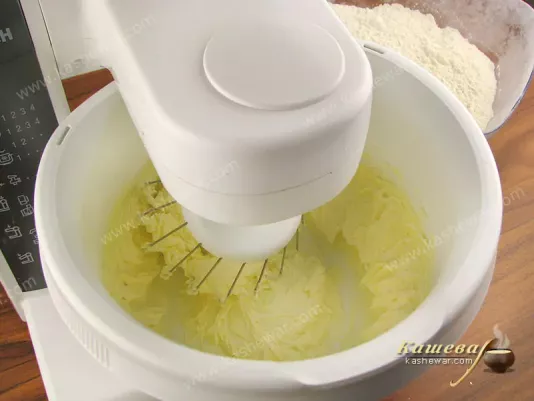 Cream butter with powdered sugar