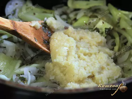 Crushed ginger with garlic in a pan with vegetables