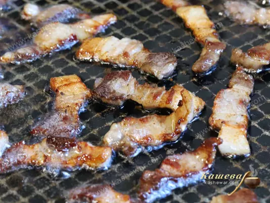 Bacon in a frying pan