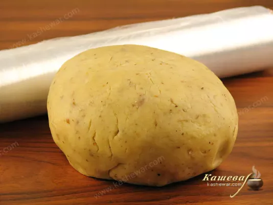 Collect the dough in a lump, wrap it in a film and in the refrigerator