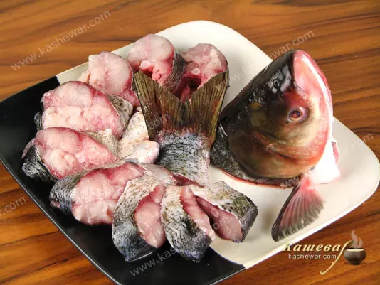Clean, wash and cut the fish along the ridge