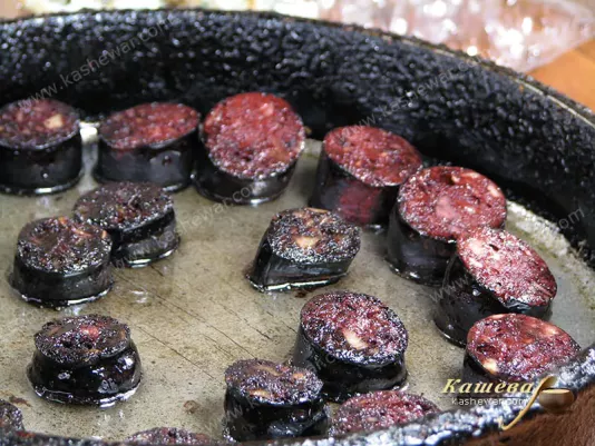 Preparing sausage and quail eggs for salad