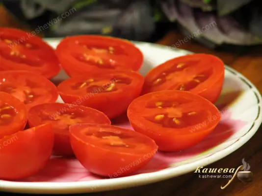 Slicing tomatoes and stringing skewers
