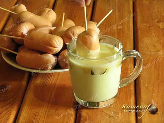 Sausages in a mug with dough