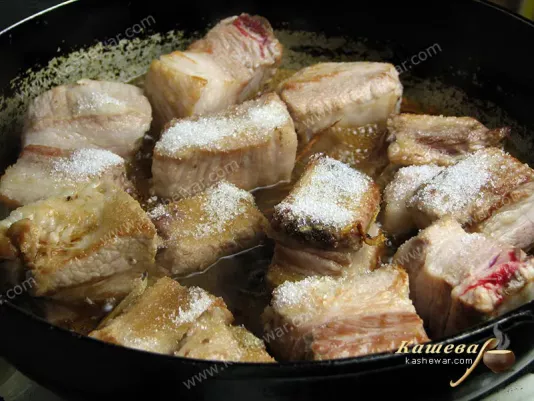 Adding to the pork ribs the rest of the ingredients
