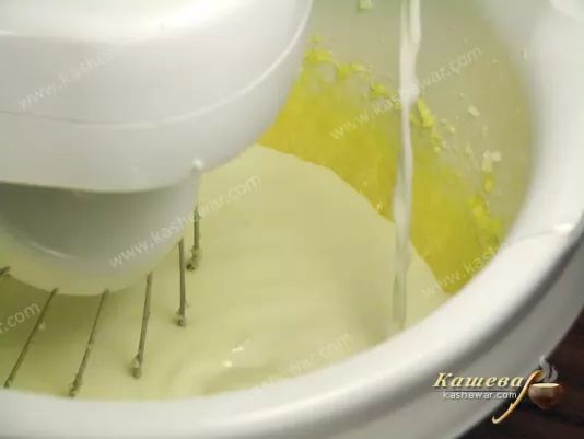 Adding yolks, milk and flour to the pudding dough