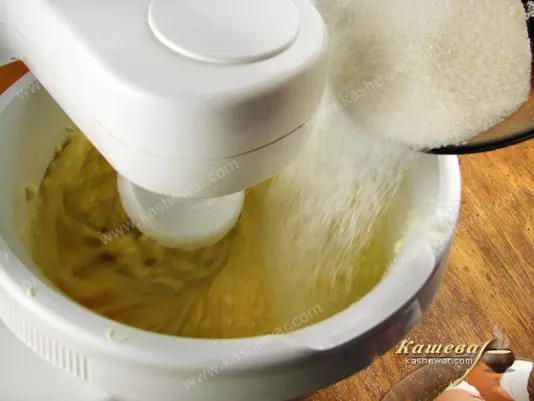 The softened butter is whipped with eggs