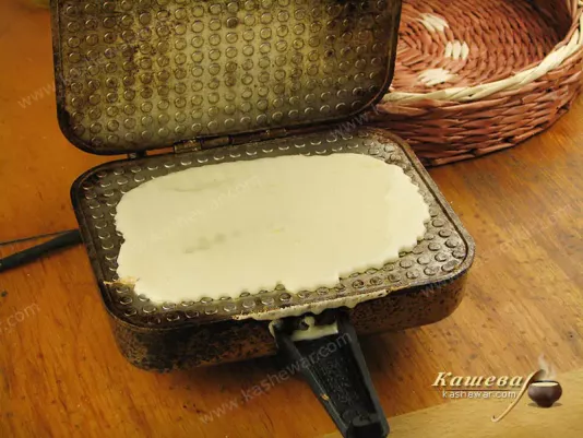 Waffles are baked from waffle dough and rolled into tubes